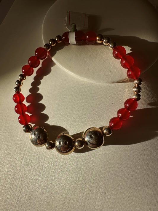 Smiley face garnet bracelet