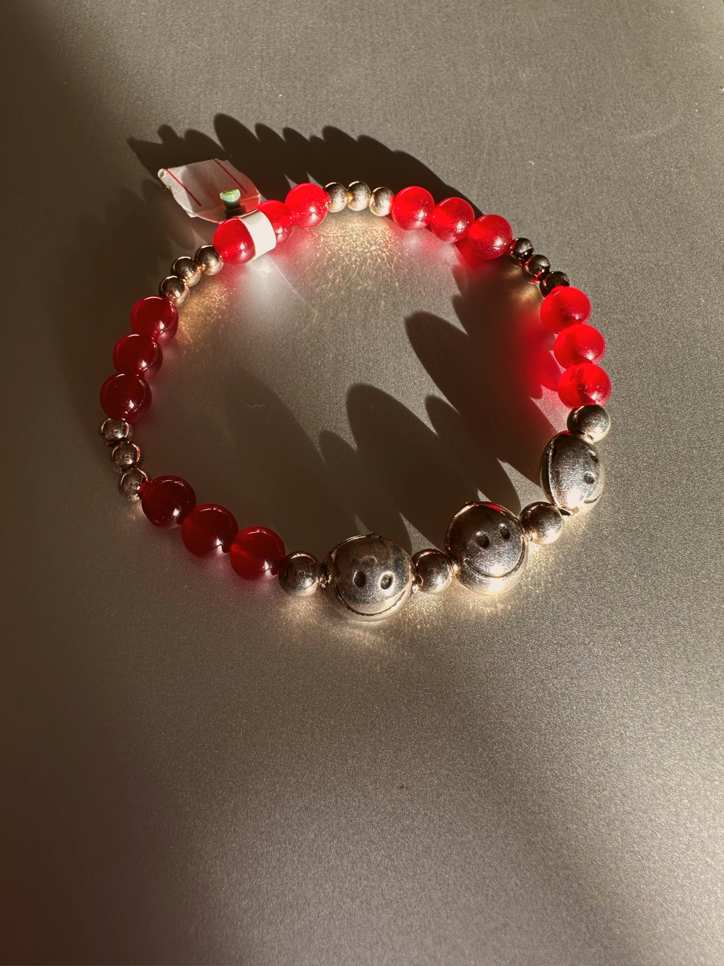 Smiley face garnet bracelet